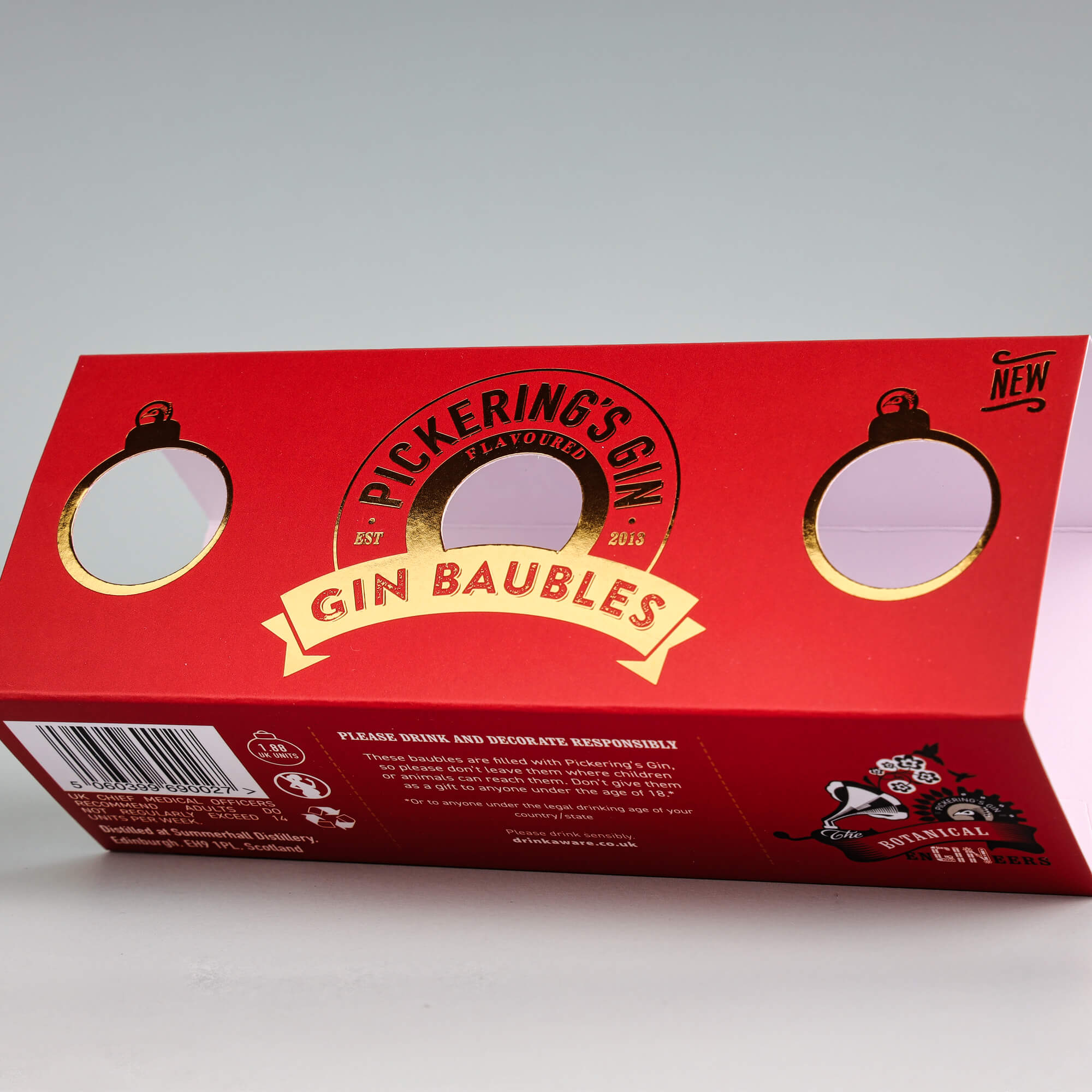 Red cardboard sleeve featuring gold foil stamping for premium packaging