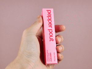handing a pink color lip packaging box front view